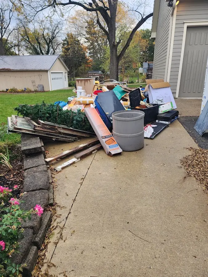 Dumpster being loaded with debris for 30 Yard Dumpster Rental in Allendale